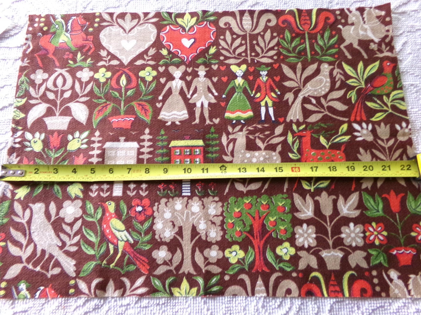 vintage barkcloth fabric in dutch country colonial style shadow print with people, hearts, birds, apple trees, houses, 16" x 22" inch piece