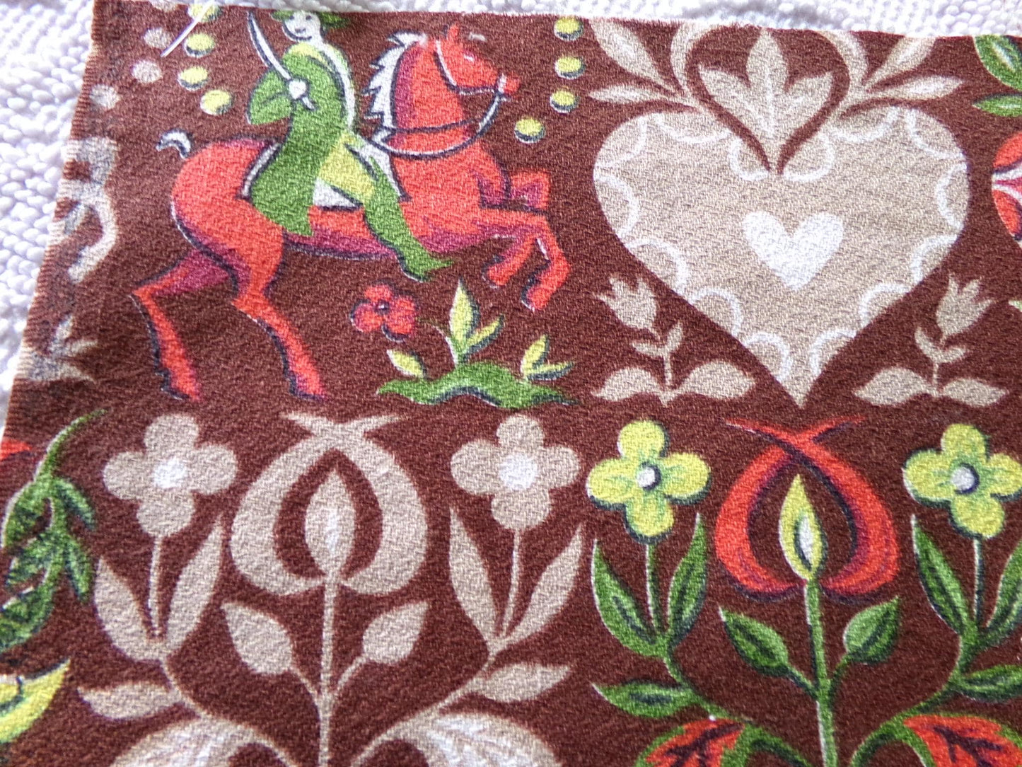 vintage barkcloth fabric in dutch country colonial style shadow print with people, hearts, birds, apple trees, houses, 16" x 22" inch piece