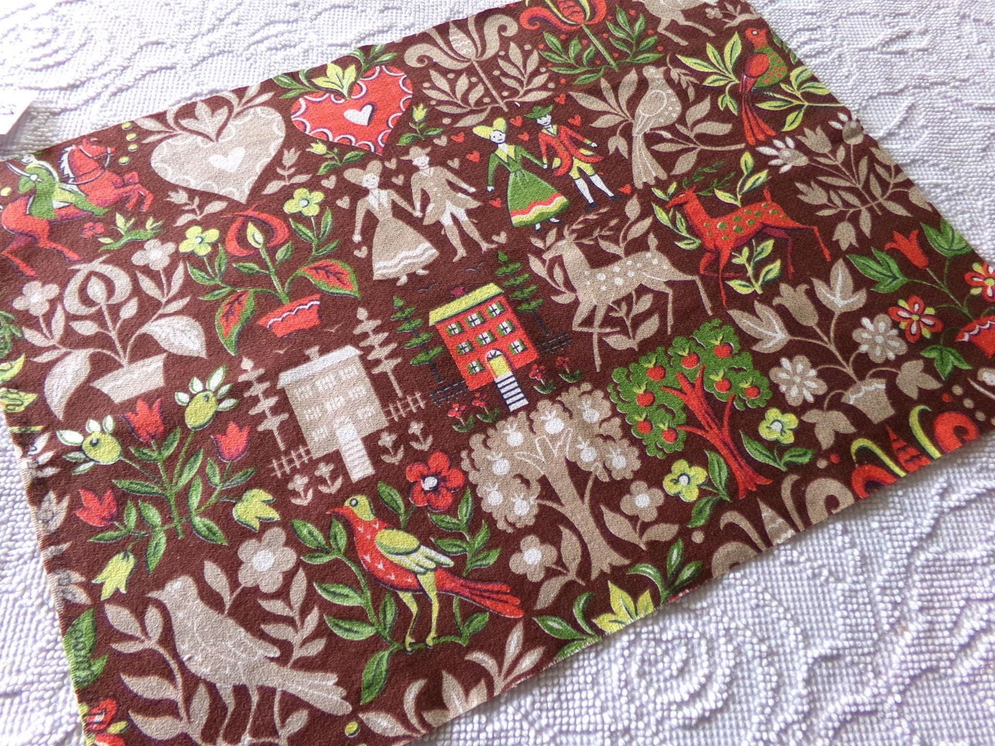 vintage barkcloth fabric in dutch country colonial style shadow print with people, hearts, birds, apple trees, houses, 16" x 22" inch piece
